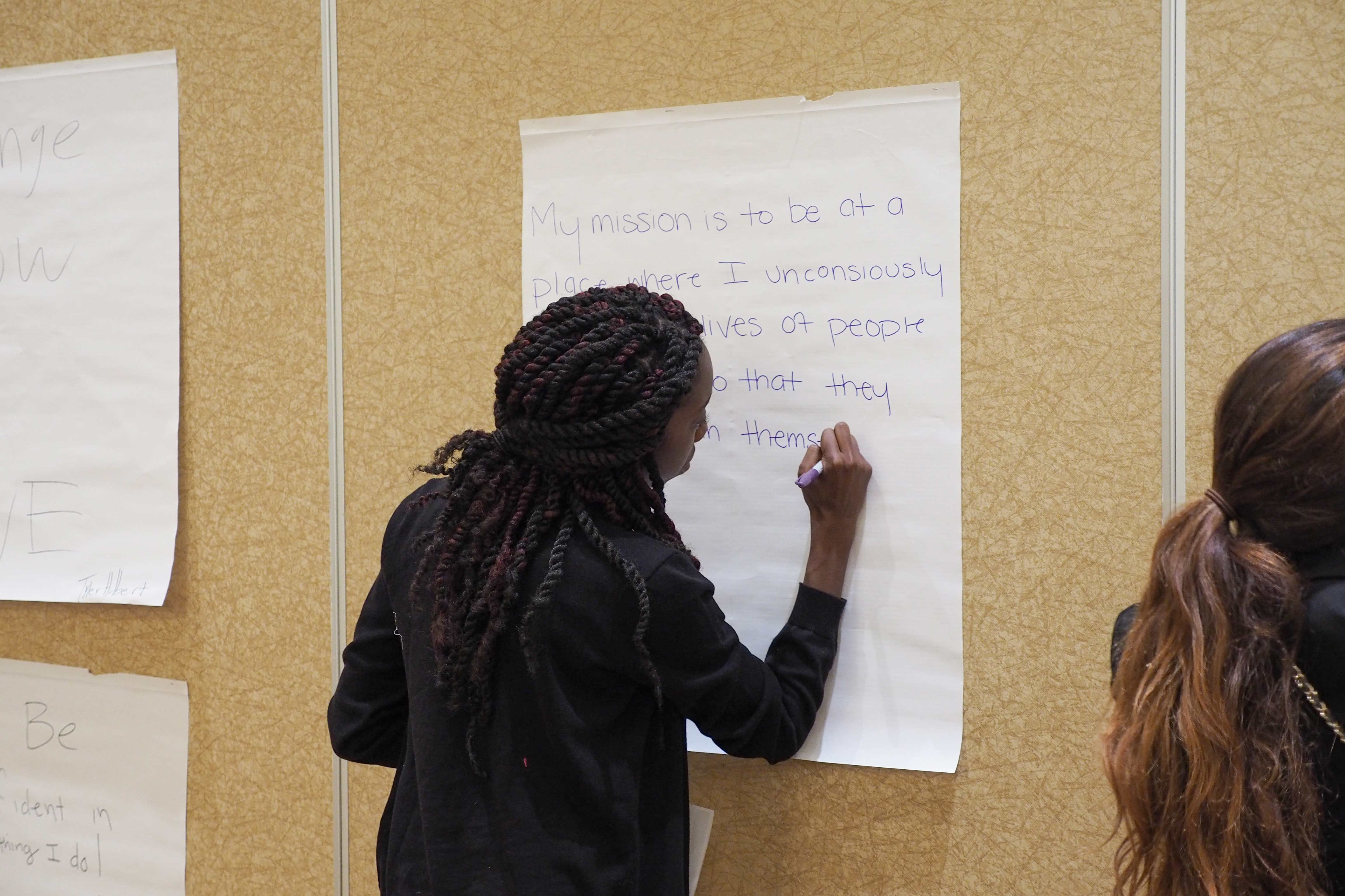 Student-writing-down-mission-statement.jpg
