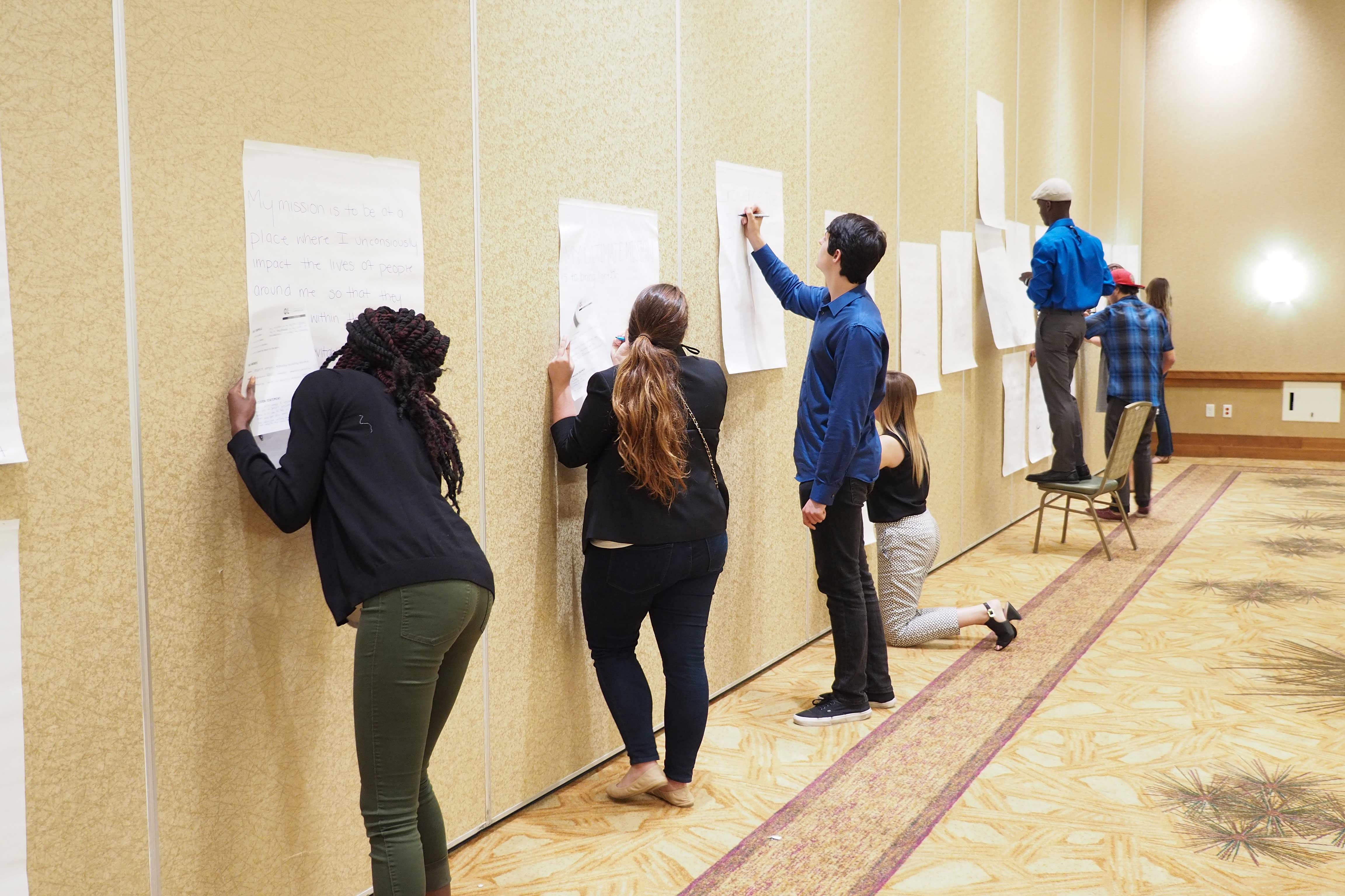 Students-writing-down-mission-statement.jpg